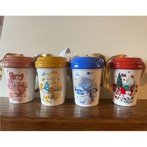 Set of Four Starbucks Disney Themed Ceramic Ornament Mugs.